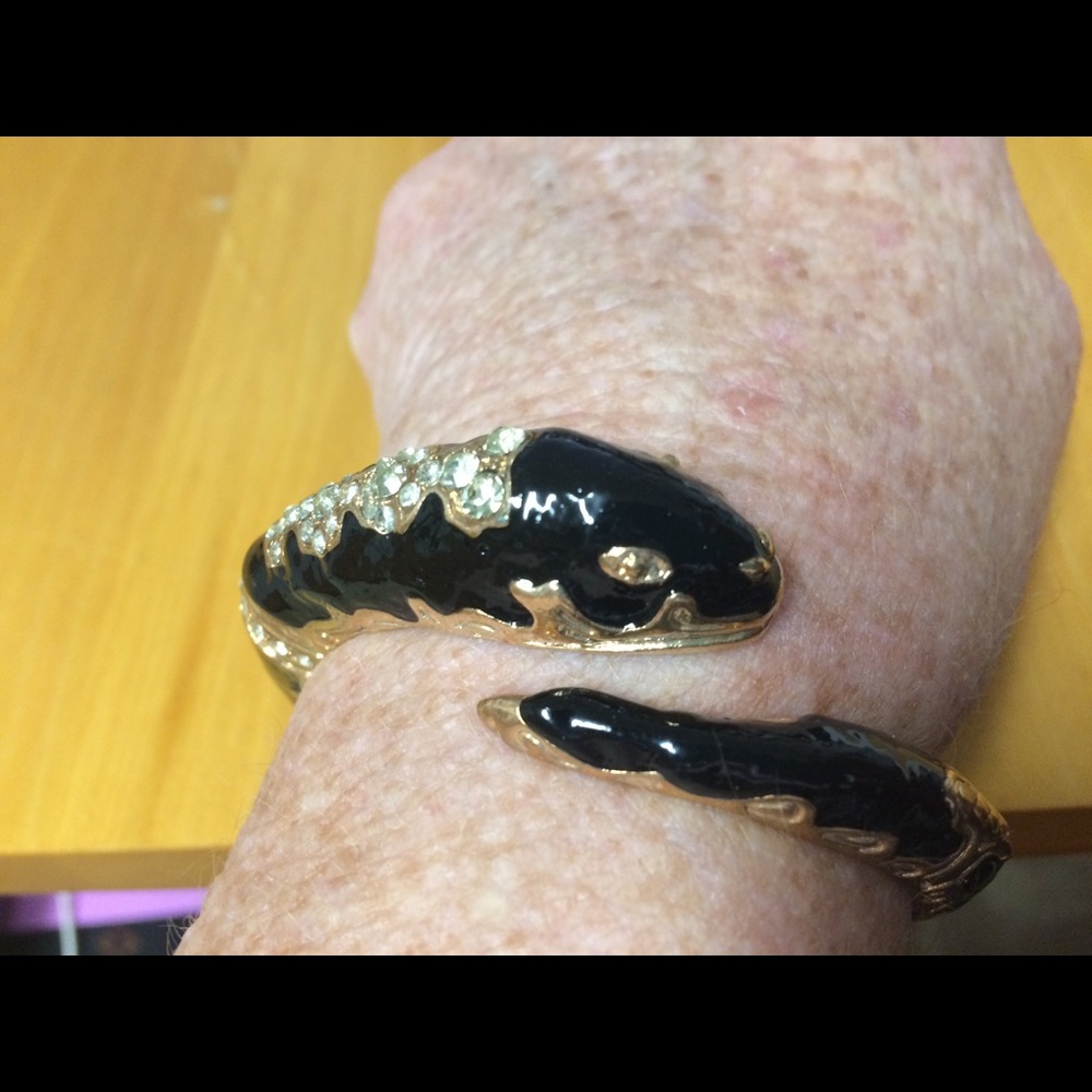 Snake bracelet, black/gold metal.